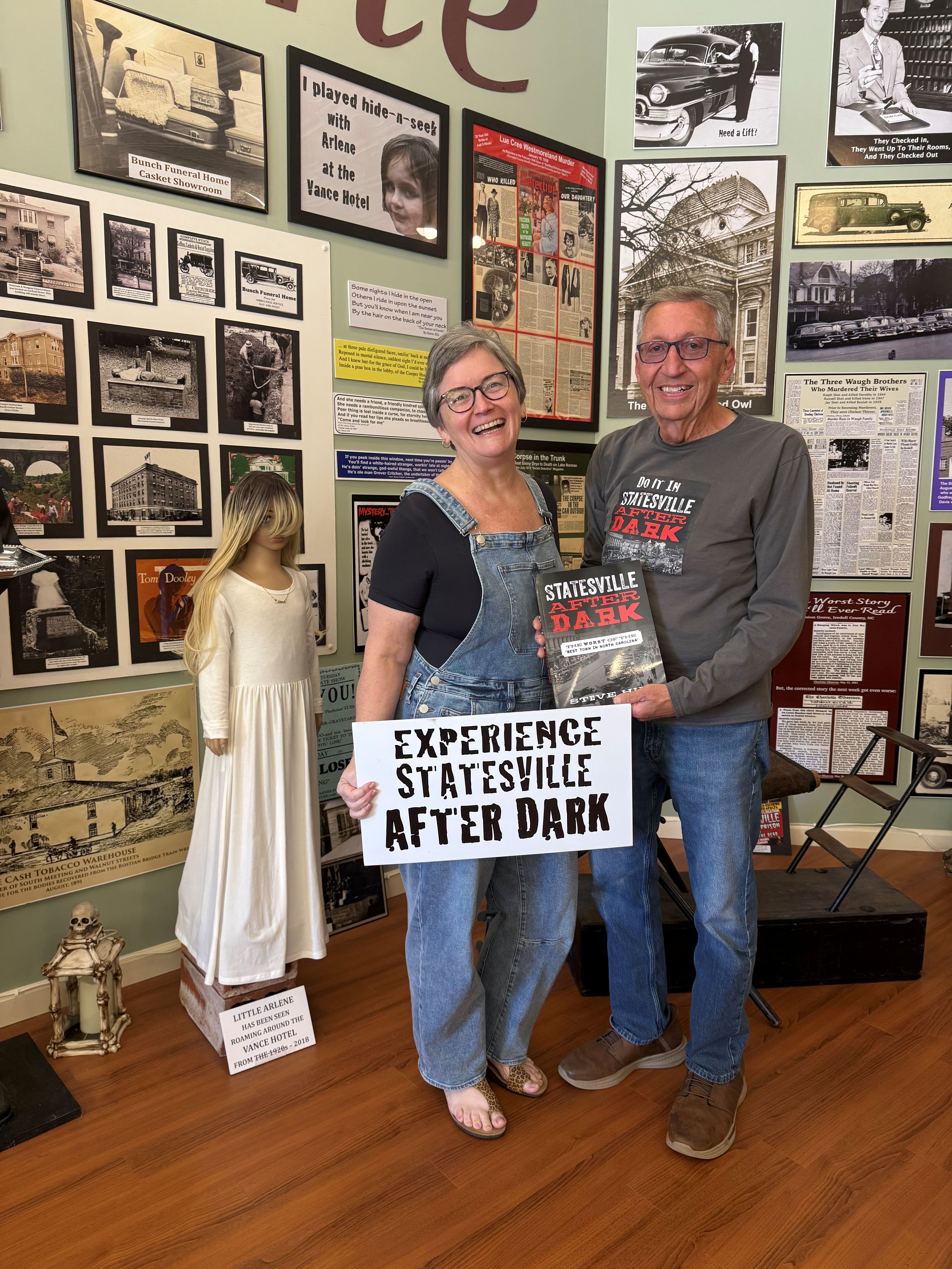 Cindy Sutton and Steve Hill smile while holding his book, Statesville After Dark, inside the Statesville Historical Collection. Cindy Sutton and Steve Hill smile while holding his book, Statesville After Dark, inside the Statesville Historical Collection.